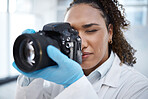 Camera, photography and medical with black woman in forensics laboratory for investigation, crime scene and evidence. Research, analytics and observation with girl and digital pictures for science