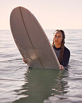 Surfer, woman and swimming in water, sea and ocean for summer adventure, freedom and vacation. Female surfing on board in waves, beach and relax for tropical holiday, nature travel and island sports