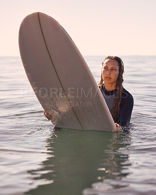 Surfer, woman and swimming in water, sea and ocean for summer adventure, freedom and vacation. Female surfing on board in waves, beach and relax for tropical holiday, nature travel and island sports