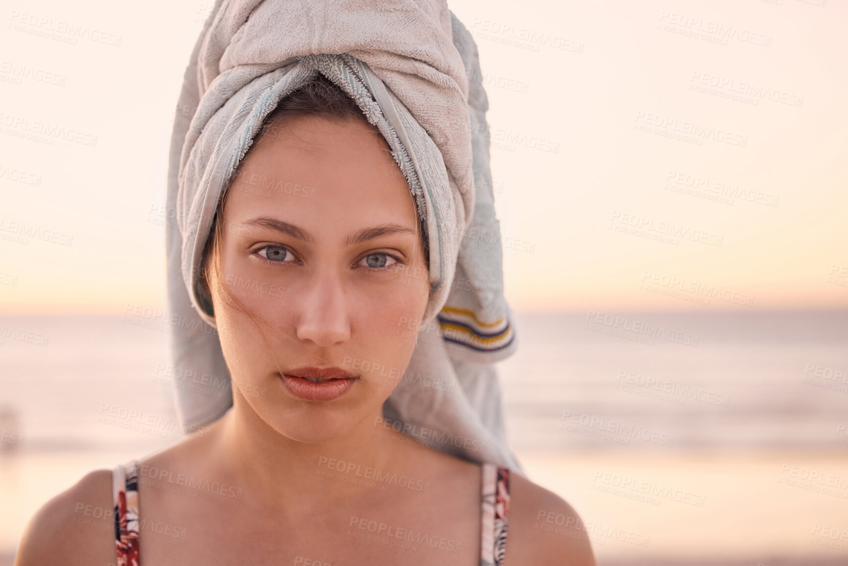 Buy stock photo Woman, face and towel at sunset ocean, summer vacation or tropical holiday in Australia. Portrait, female and relax at beach with wet hair cloth, nature and freedom of calm lifestyle at travel resort