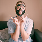 Skincare, face mask and goofy woman in her house, home or apartment doing morning beauty routine with hand gesture. Portrait, relax and female taking picture sign for skincare using charcoal