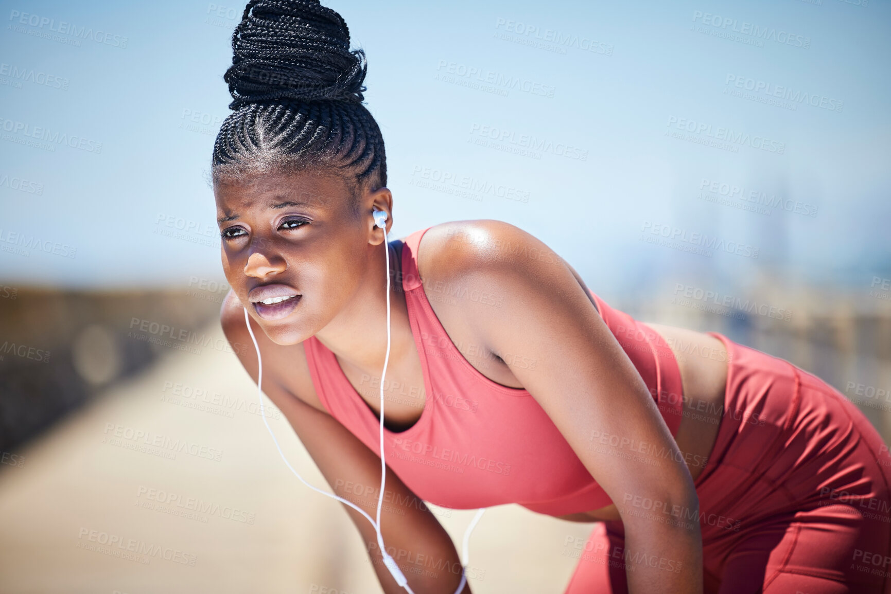 Buy stock photo Tired, breathing and black woman training for fitness, healthy target and body fatigue. Female athlete, break and breathe for sports workout, running and exercise with music earphones for challenge 