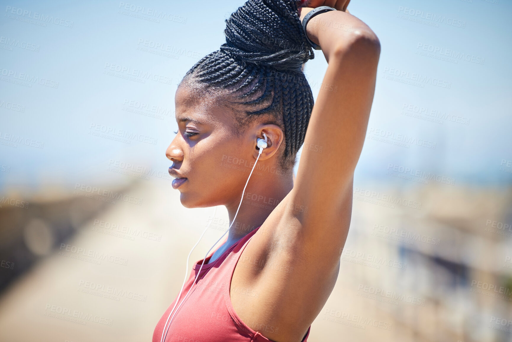 Buy stock photo Fitness, black woman and stretching outdoor with earphones for exercise, workout and training. Female athlete, focus and warm up to music for strong runner motivation, mindset goals and sports energy