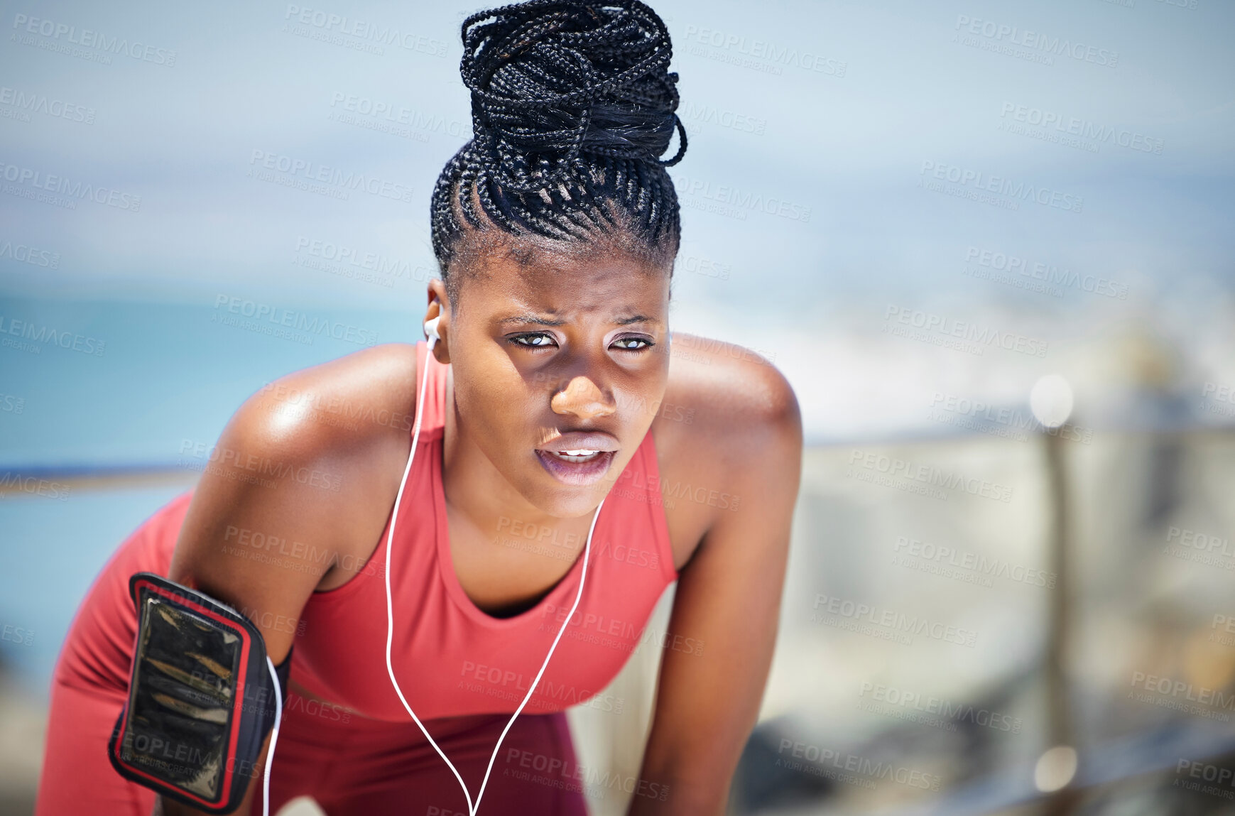 Buy stock photo Tired, running and black woman with runner fatigue by the ocean for workout, exercise and fitness. Summer, sweating and marathon run of a athlete on a sprinter break by the sea with rest from sport