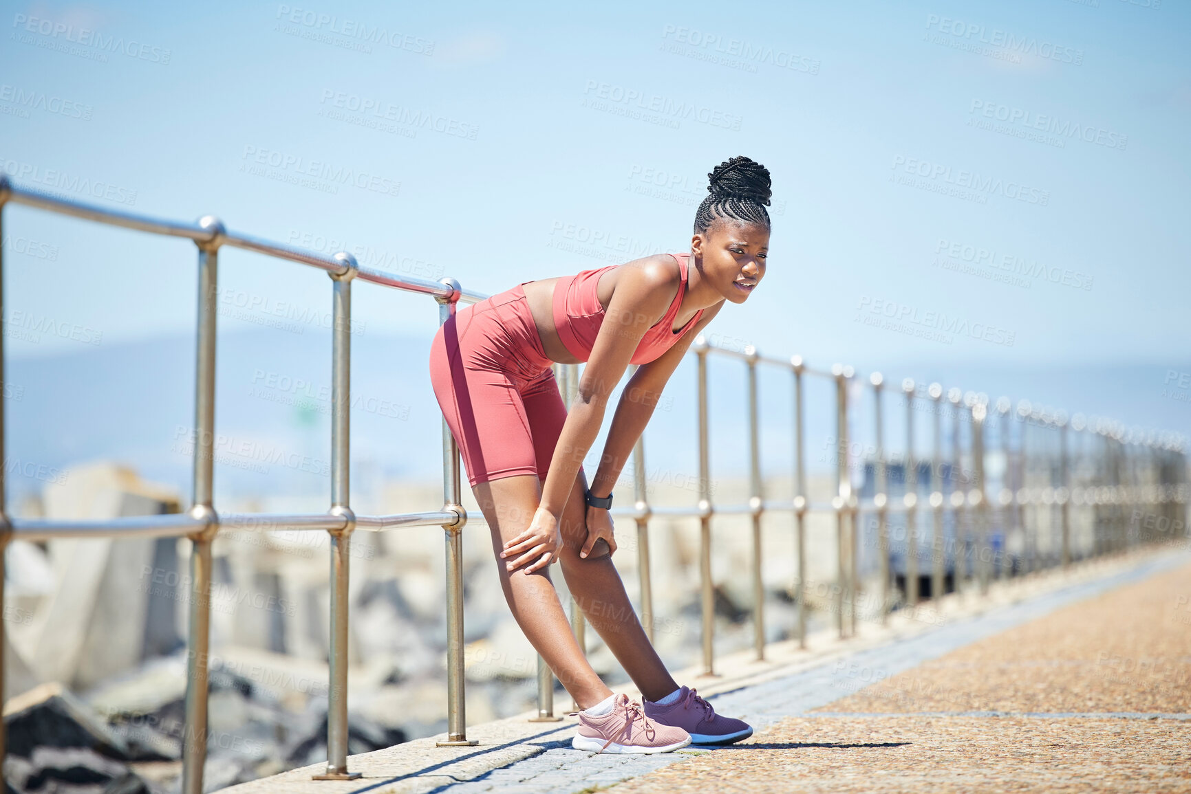 Buy stock photo Fitness, tired and black woman breathing after an outdoor running workout on the beach promenade. Sports, health and exhausted African female on a break with fatigue after cardio exercise or training