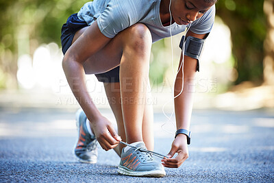 Buy stock photo Shoes, running and athlete tie laces ready to exercise, workout or fitness outdoors in a park by female training. Active, fit and closeup of person or runner preparing to jog for health and wellness