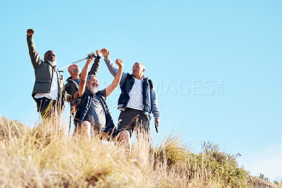 Buy stock photo Senior, men and hiking success in nature, celebration and victory, cheering and happy on blue sky background. elderly, friends and man hiker group celebrating achievement, freedom and exercise goal