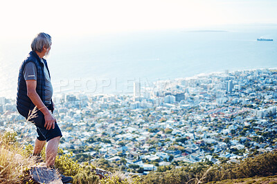 Buy stock photo Hiking, explore and senior man with city view for on an adventure, workout and fitness in Cape Town. Training, exercise and elderly person trekking on a mountain for health and wellness