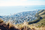 City, ocean and view with a panoramic landscape of the sea on the coast of an urban town or development. Sky, background or scenic and water around a coastal panorama with buildings and nature