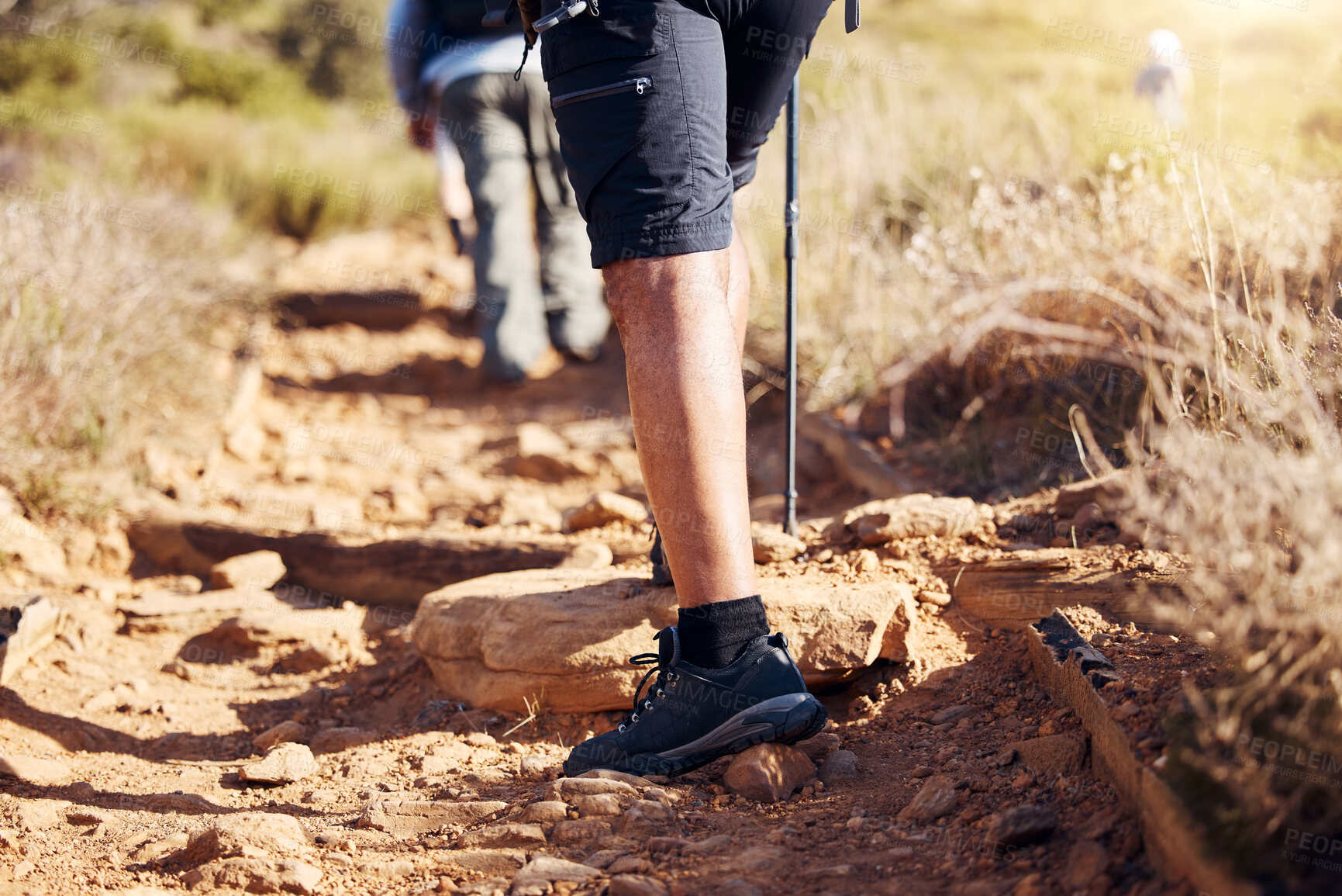 Buy stock photo Closeup, legs and hiker in nature, fitness and exercise for wellness, fresh air and on summer vacation. Zoom, leg and athlete outdoor, hiking and workout in the wilderness for health and adventure