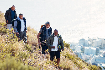 Buy stock photo Group, senior and men hiking or trekking on mountain in Cape Town for exercise, workout or fitness. Team, teamwork and elderly people training outdoors in nature for an adventure, explore and health