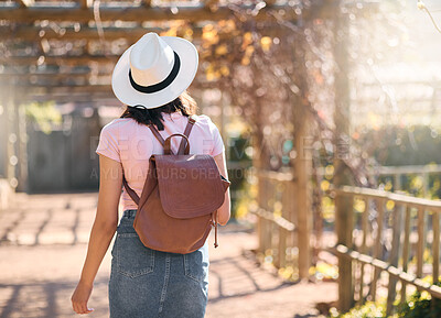 Buy stock photo Back, woman and travel for summer, outdoor and walking for sightseeing, break and vacation. Female tourist, student and lady with backpack, explore landmarks or enjoy holiday for adventure or journey