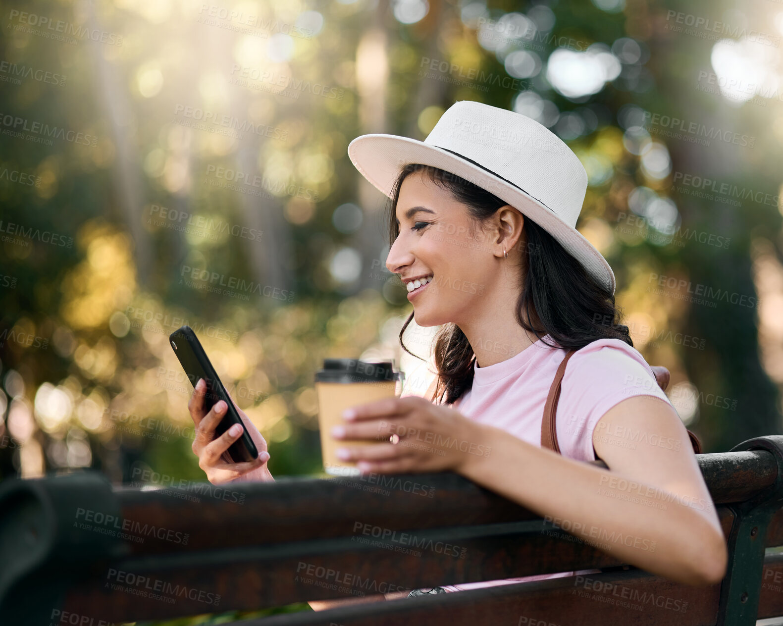 Buy stock photo Happy, search or woman with phone on park bench in morning for social media, networking or reading comic blog. Smile, coffee or girl on 5g smartphone for freedom, web or internet news communication