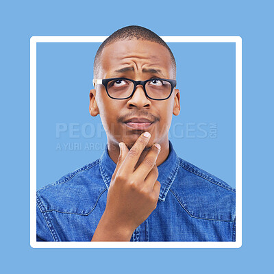Buy stock photo Confused, thinking and black man in studio with frame, mockup and blue background space. Doubt, unsure and contemplation with a guy thoughtful in border, pensive or emoji collage while isolated