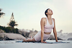 Yoga, stretching and woman on a beach floor for wellness, peace and zen, pose and balance on sky background. Meditation, stretch and girl relax with training, energy and peaceful, mindset or workout