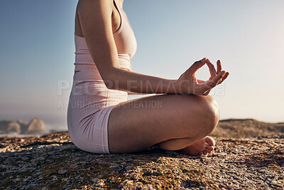 Buy stock photo Woman, hands and yoga in nature for wellness, peace and zen, lotus pose and balance on blue sky and rocks. Fitness, girl and meditation, training and energy outdoor for peaceful, mindset and workout