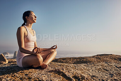 Buy stock photo Relax and yoga and woman in lotus pose in nature for wellness, peace and zen on blue sky mockup. Fitness, girl and meditation, training and energy outdoor, mindset, breathing and posture workout