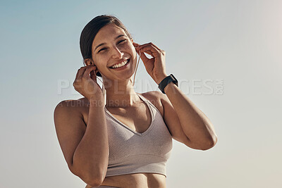 Buy stock photo Fitness, portrait and music for woman at a beach for running, training and cardio on sky background. Happy, face and radio for girl on mockup for exercise, wellness and motivation with podcast track