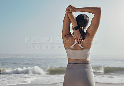 Buy stock photo Back, stretching and woman and a beach for yoga, fitness and cardio on ocean mockup. Rear view, arm and stretch for girl during meditation, exercise and workout at the sea for wellness and peace