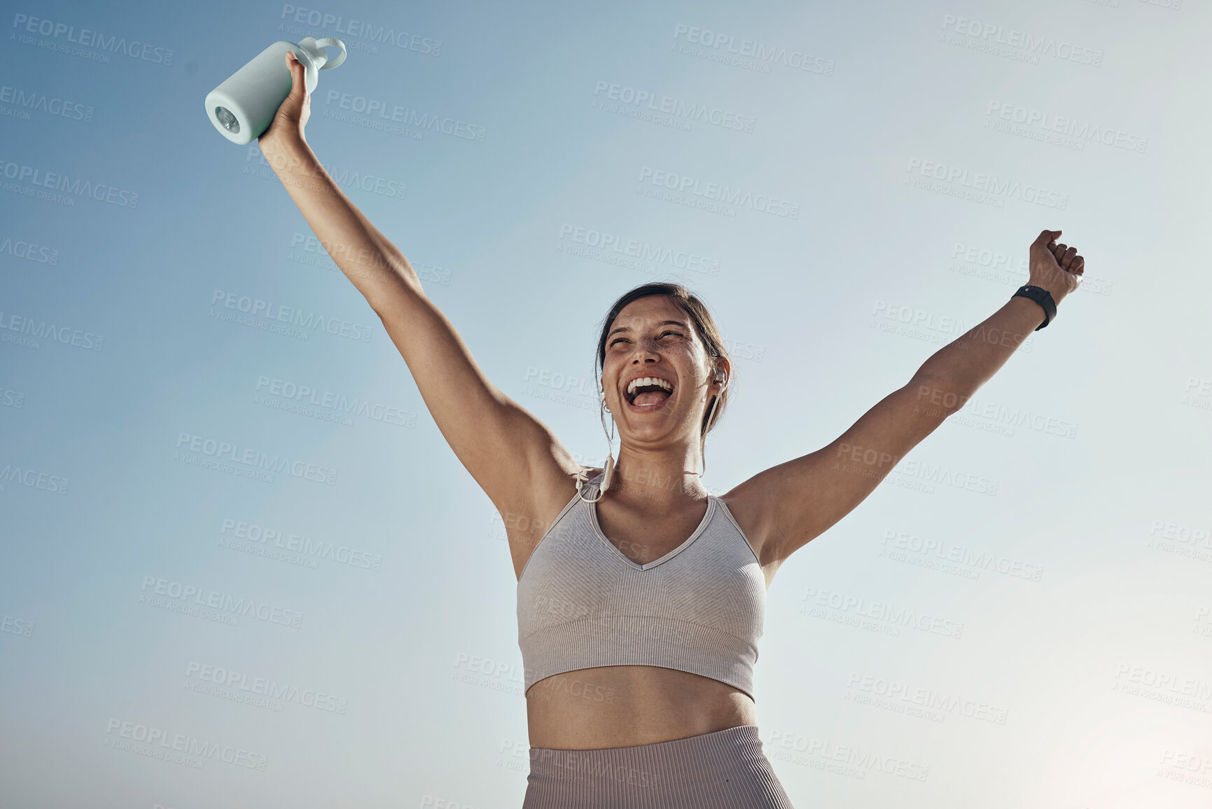 Buy stock photo Fitness success, blue sky and woman arms in air with water bottle outdoor. Excited, happy smile and athlete with sports feeling freedom from motivation and happiness with exercise target goal