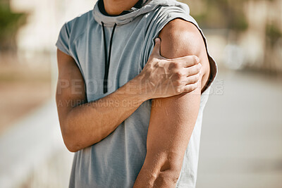 Buy stock photo Arm, mockup and man in street with injury or ache in fitness, sports or cardio on blurred background. Shoulder pain, runner and hands of guy suffering heart attack sign, accident or risk in workout