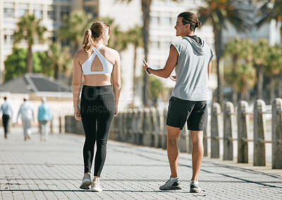 Buy stock photo Fitness, teamwork or health with a runner couple on the promenade for cardio or endurance from the back. Exercise, wellness or workout with a man and woman athlete running outdoor in the city