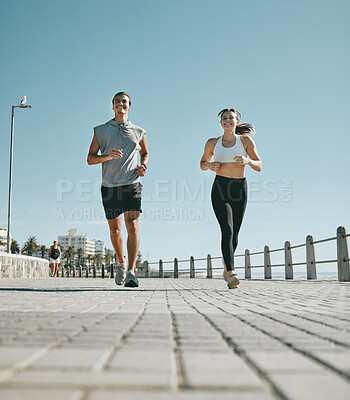 Buy stock photo Couple, fitness and running by beach in the city for exercise, workout or cardio routine together. Happy man and woman runner taking a walk or jog for healthy wellness or exercising in Cape Town