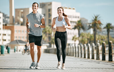 Buy stock photo Couple, fitness and running together in the city for exercise, workout or cardio routine in Cape Town. Happy man and woman runner taking a walk or jog for healthy wellness or exercising outside