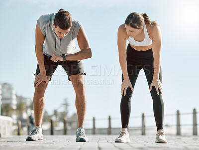 Buy stock photo Running, tired couple and watch for time, performance and goals on blue sky for wellness. Man and woman outdoor in nature for workout, fitness and exercise for healthy lifestyle and body fatigue