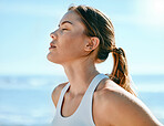 Face, breathing and sweating with an exercise woman outdoor in nature for a cardio or endurance workout. Fitness, breath or sweat and an attractive young female athlete standing with her eyes closed
