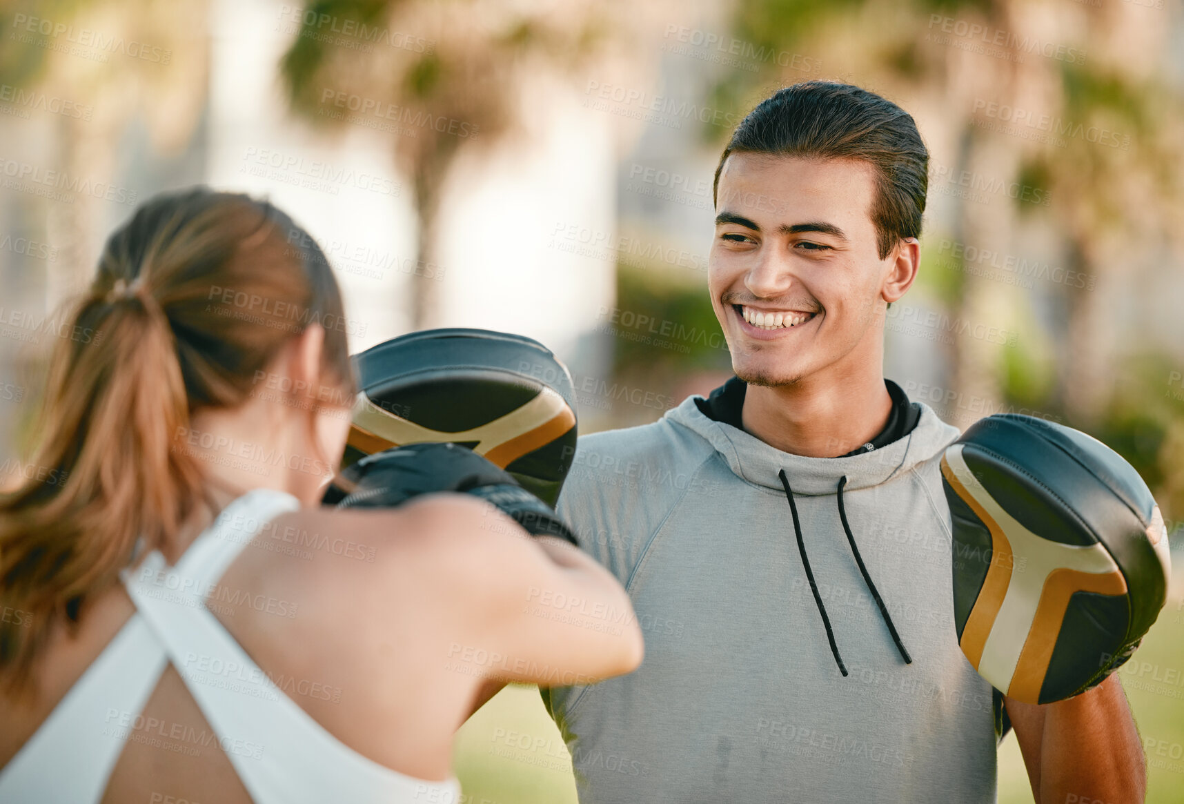 Buy stock photo Man, personal trainer and boxing exercise outdoor in nature park for fitness, health and wellness. Couple of friends happy about sports workout or fight training with motivation, energy and coaching