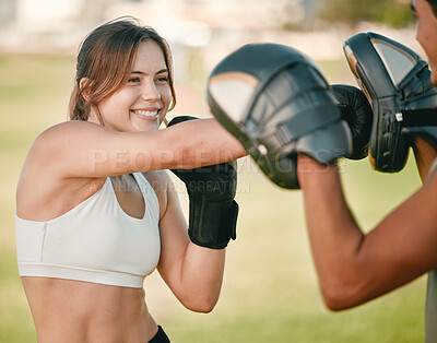 Buy stock photo Woman, boxing and personal trainer exercise outdoor in nature park for fitness, health and wellness. Couple of friends happy about sports workout or mma training with motivation, energy and coaching