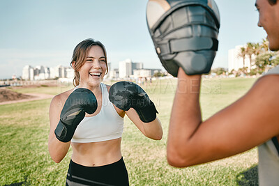Buy stock photo Fitness, personal trainer and boxing woman outdoor for exercise in nature park for health and wellness. Couple of friends happy about sports workout or fight with support, motivation and man coach