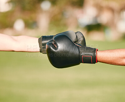 Buy stock photo Team, boxing gloves and people fist bump in celebration, collaboration and teamwork in combat sports outdoors. Boxer, hands and friends or fighter training together as workout, exercise and fitness