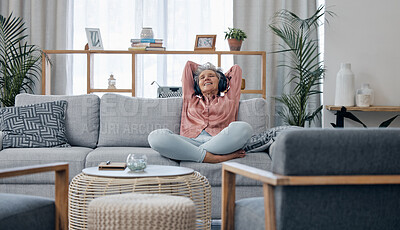 Buy stock photo Retirement, old woman and sofa with headphones, relax and calm in living room, streaming music and audio. Female senior citizen, happy mature lady and headset for podcast, radio and carefree on couch