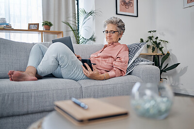 Buy stock photo Retirement, old woman on sofa and smartphone for connection, social media and chatting. Female senior citizen, elderly lady and laptop to check pension fund, investments and relax on couch in lounge