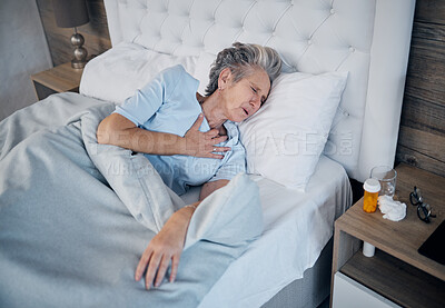 Buy stock photo Heart attack, bedroom and senior woman with chest pain, sick and medical risk with medicine. Pills, stress or stoke of elderly person cardiology, breathing or lung problem with healthcare emergency