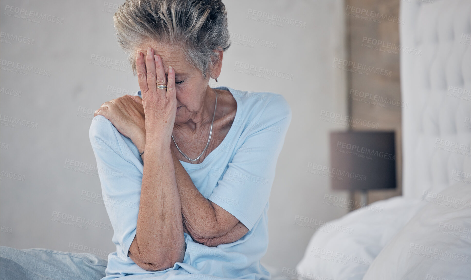 Buy stock photo Headache, sick and mature woman with depression, anxiety or mental health problem in the bedroom. Sad, stress and elderly person with insomnia, migraine pain and depressed from fatigue or divorce