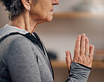 Senior woman, yoga and hands in meditation for spiritual wellness, zen exercise or peace at home. Hand of elderly female meditating in relax for healthy fitness, awareness or namaste in stress relief
