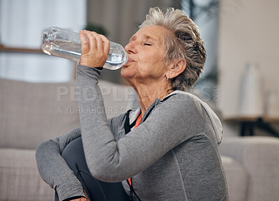 Buy stock photo Drinking, water and fitness with a senior woman in her home for wellness, hydration or retirement. Exercise, drink or thirsty with a mature female training in a house during a workout to stay active