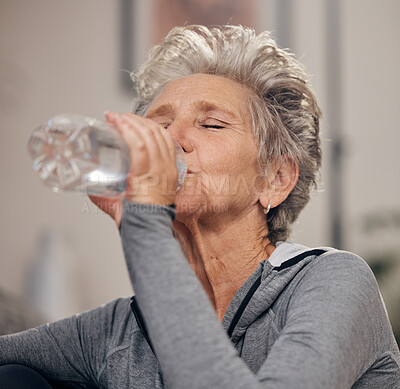 Buy stock photo Drinking water, fitness and retirement with a senior woman in her home for wellness or hydration. Exercise, drink or thirsty with a mature female training in her house during a workout to stay active