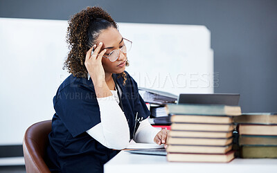 Buy stock photo Medical student, tired or stress in hospital research, wellness books studying or education technology learning. Thinking woman, burnout or healthcare nurse anxiety in scholarship medicine internship