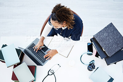 Buy stock photo Top view, laptop or nurse in hospital research, education studying or university books learning for medical student. Above, woman or healthcare worker on technology in scholarship medicine internship