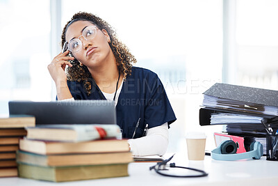 Buy stock photo Nurse, thinking or planning in hospital research, wellness books study or laptop education vision in medicine scholarship. Medical student, woman or healthcare ideas for worker technology internship