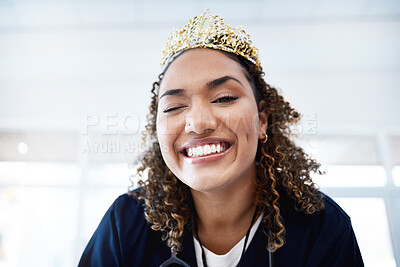 Buy stock photo Portrait, crown and wink with a nurse in a hospital for healthcare having fun or feeling playful. Medical, winner and comic with a female internship student winking in a clinic for promotion
