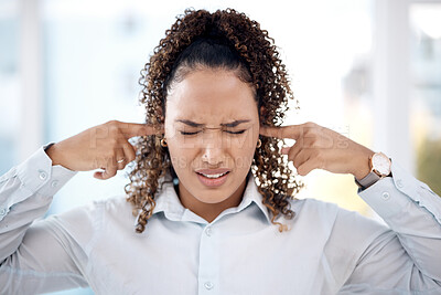 Buy stock photo Noise, loud and woman closing her ears for the sounds in the office while working on a project. Annoyed, frustrated and upset professional female employee plug her fingers in her ear in the workplace