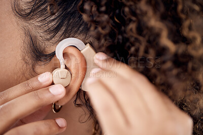 Buy stock photo Closeup, deaf and woman with cochlear implant for hearing, audio and aid for disability or impairment. Sound, hands and girl fitting device to help with communication, listening and interaction