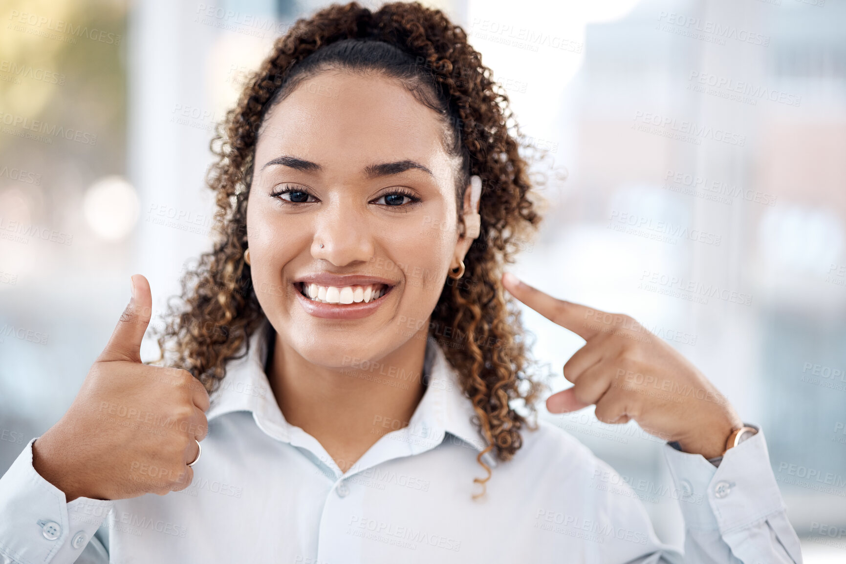 Buy stock photo Black woman, portrait smile and thumbs up for hearing aid, auditory treatment or audiologist at clinic. Happy African American female smiling showing hand thumb emoji for listening success or thanks