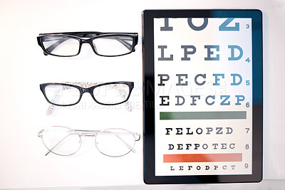 Buy stock photo Optometry, glasses and letter for eye exam on tablet for sight, vision testing and medical care. Optometrist, healthcare and frames, prescription lens and eyeglasses for eyes with test on screen