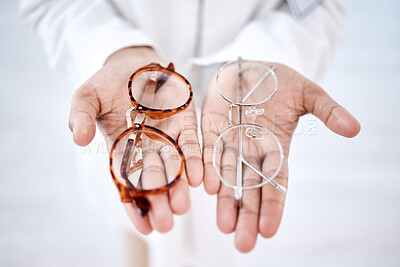 Buy stock photo Optometry, vision and hands with glasses for choice, option and choosing medical product for eyes. Optometrist,  healthcare and palms with frame, prescription lens and eyeglasses for sight correction